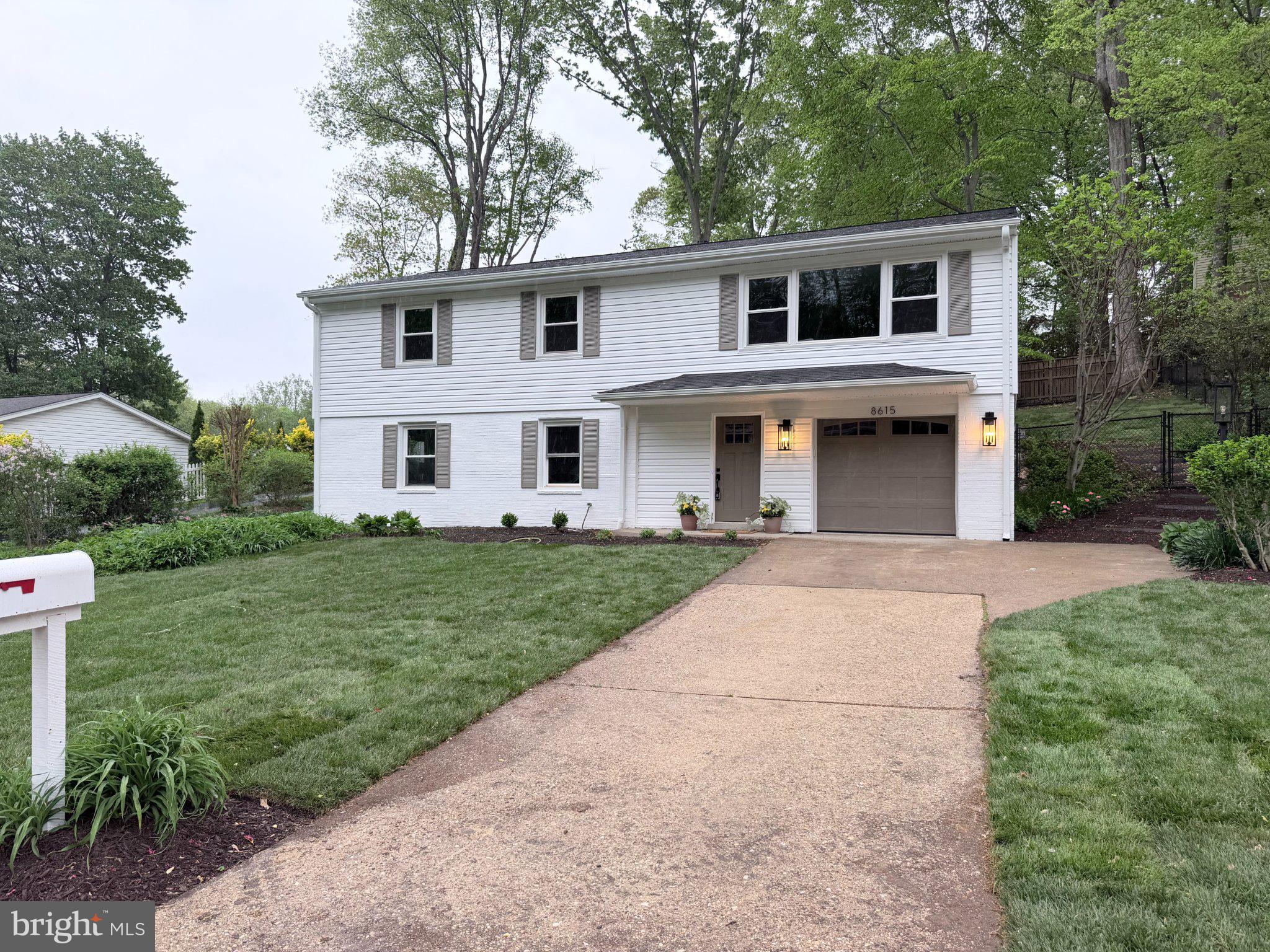 8615 Kerry Lane Springfield, VA 22152 - Photo 2 of 50 front view of a house with a yard