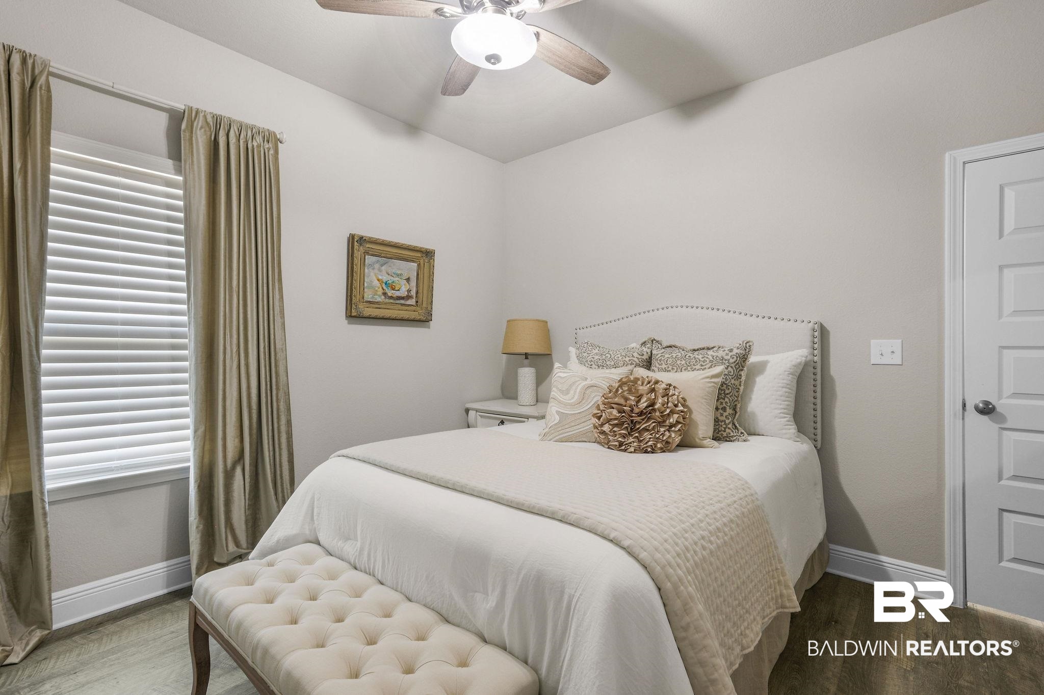 9056 Impala Drive Foley, AL 36535 - Photo 15 of 22 Bedroom with dark hardwood / wood-style flooring and ceiling fan