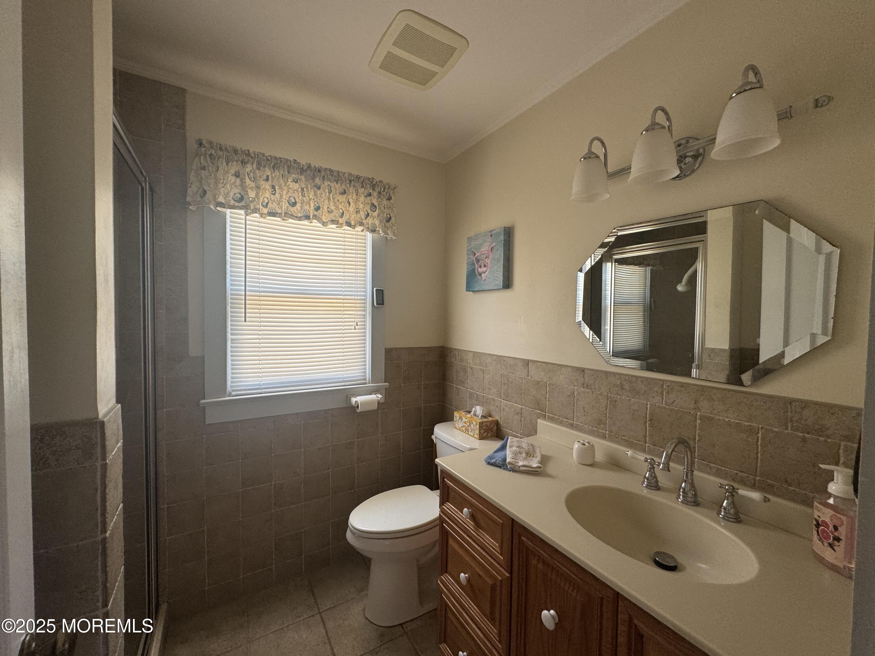 115 Boardwalk Point Pleasant Beach, NJ 08742 - Photo 23 of 23 a bathroom with a sink vanity mirror and toilet