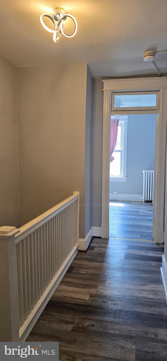 735 Princeton Place Northwest Washington, DC 20010 - Photo 5 of 11 a view of a hallway with wooden floor
