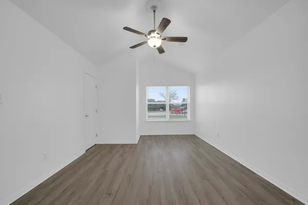 a view of wooden floor and chandelier in a room