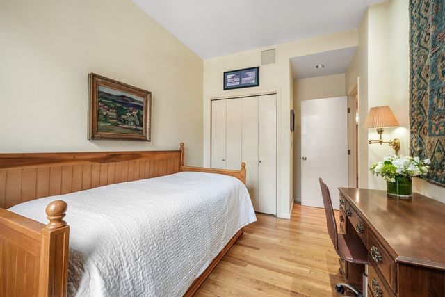 a bedroom with a bed and a table