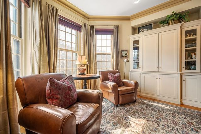 a living room with furniture and windows