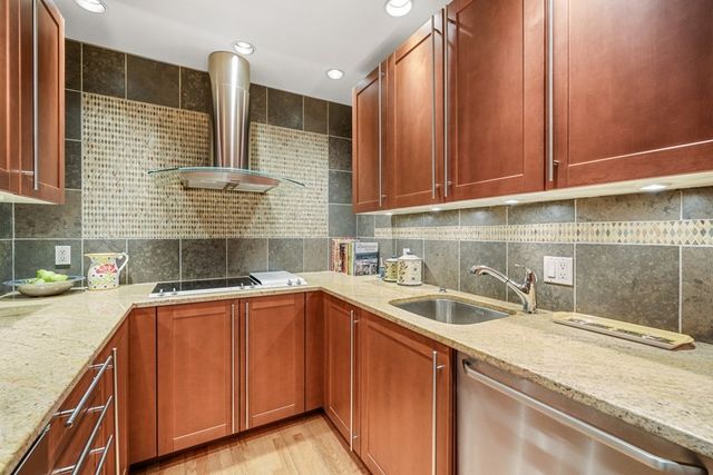 a kitchen with a sink and cabinets