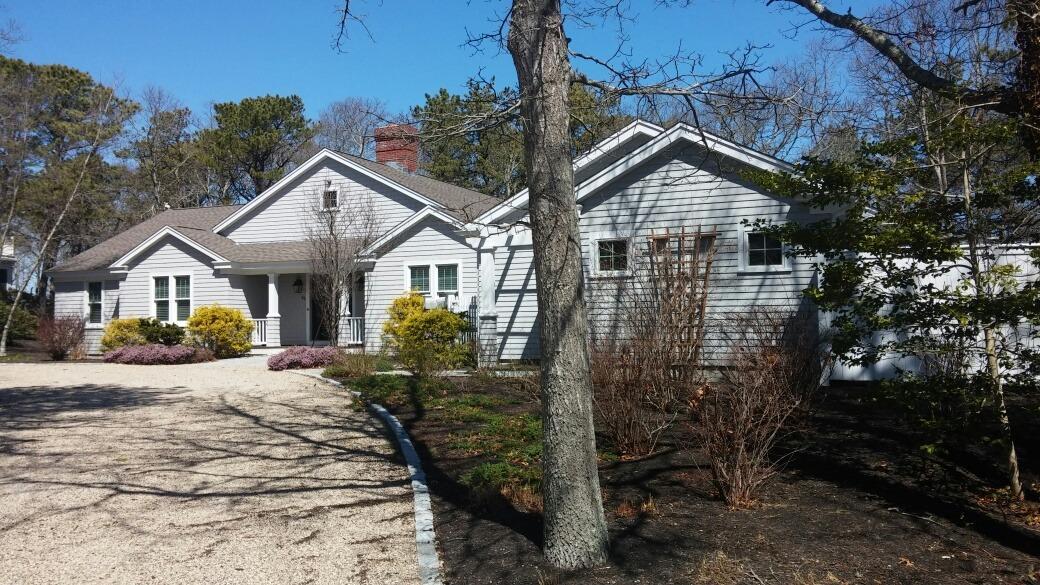 84 Troon Way Mashpee, MA 02649 - Photo 2 of 31 a front view of a house with yard