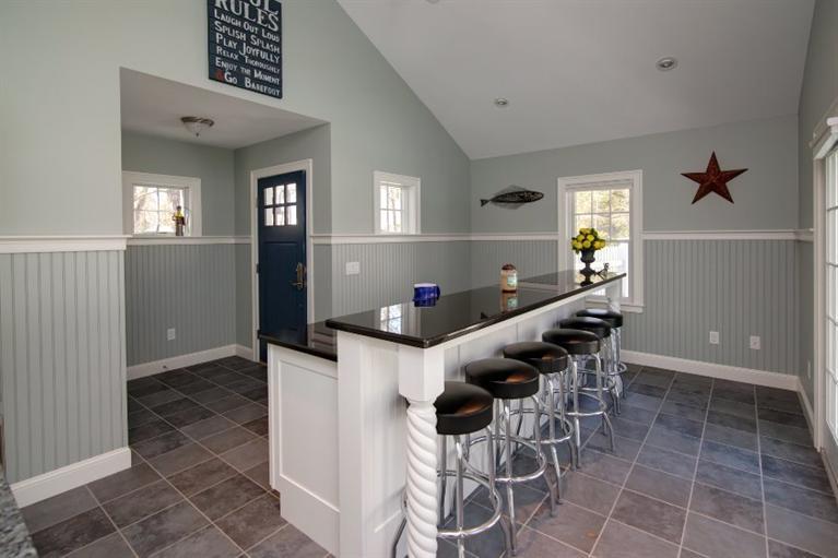 84 Troon Way Mashpee, MA 02649 - Photo 23 of 31 a dining room with furniture and a window