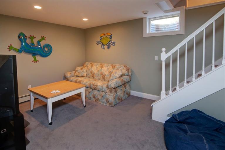 84 Troon Way Mashpee, MA 02649 - Photo 25 of 31 a living room with furniture and a rug