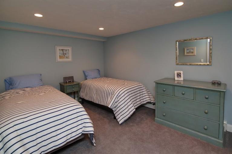84 Troon Way Mashpee, MA 02649 - Photo 27 of 31 a bedroom with two beds and a dresser
