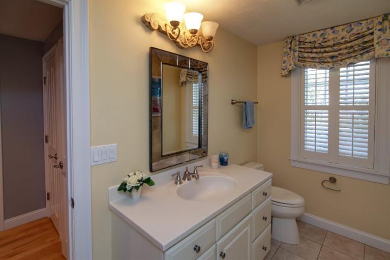 84 Troon Way Mashpee, MA 02649 - Photo 29 of 31 a bathroom with a sink a toilet and a mirror