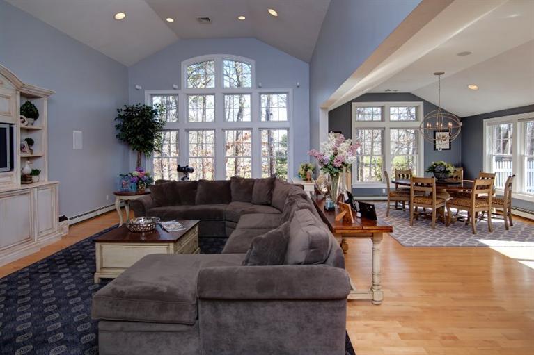 84 Troon Way Mashpee, MA 02649 - Photo 8 of 31 a living room with furniture and a large window