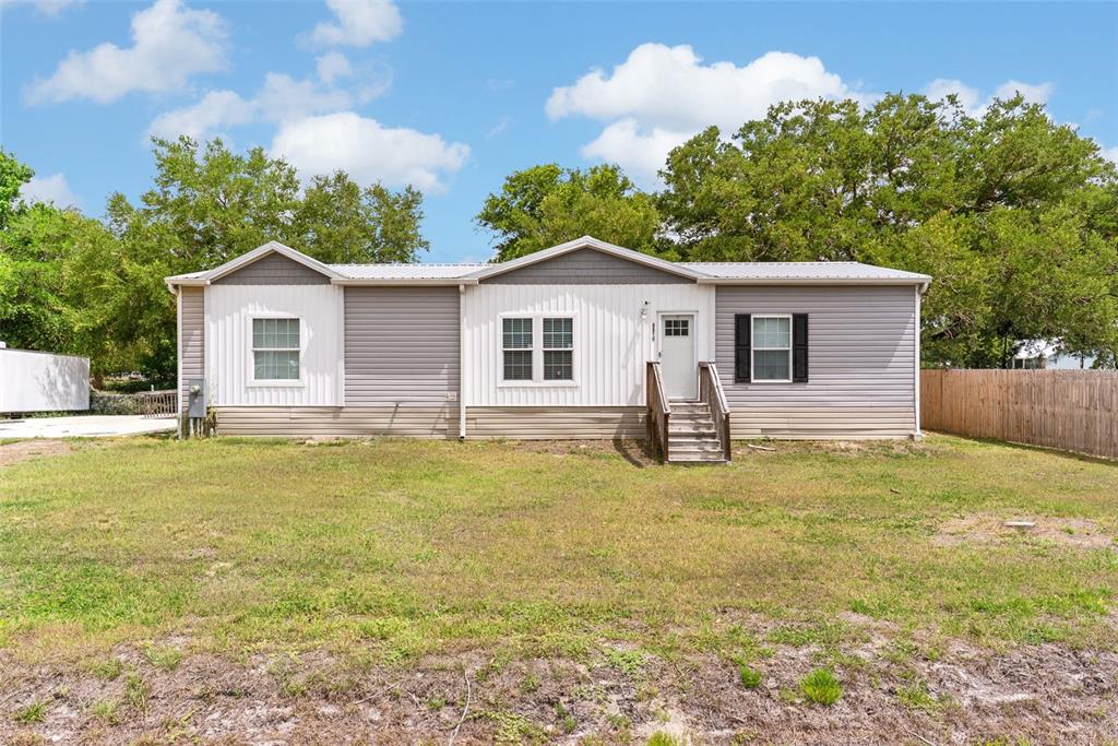 8010 Palmer Road Bartow, FL 33830 - Photo 2 of 22 a front view of house with yard and trees