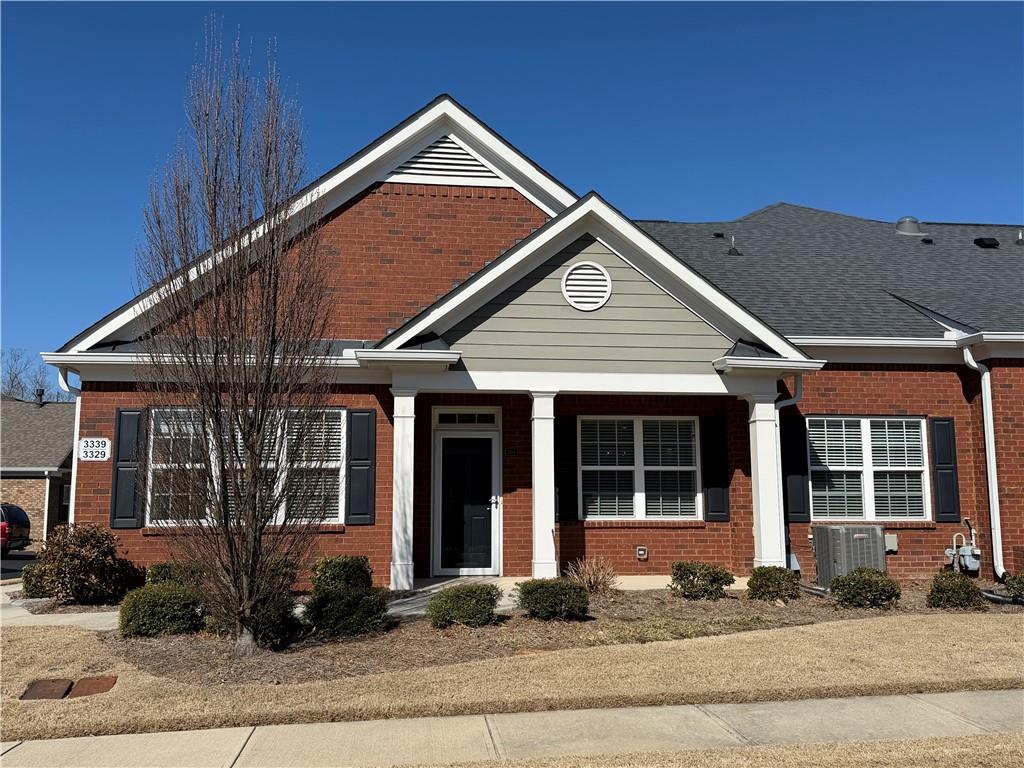 3329 Ivy Ridge Court, Unit 791 Buford, GA 30519 - Photo 1 of 36 a front view of a house with a yard