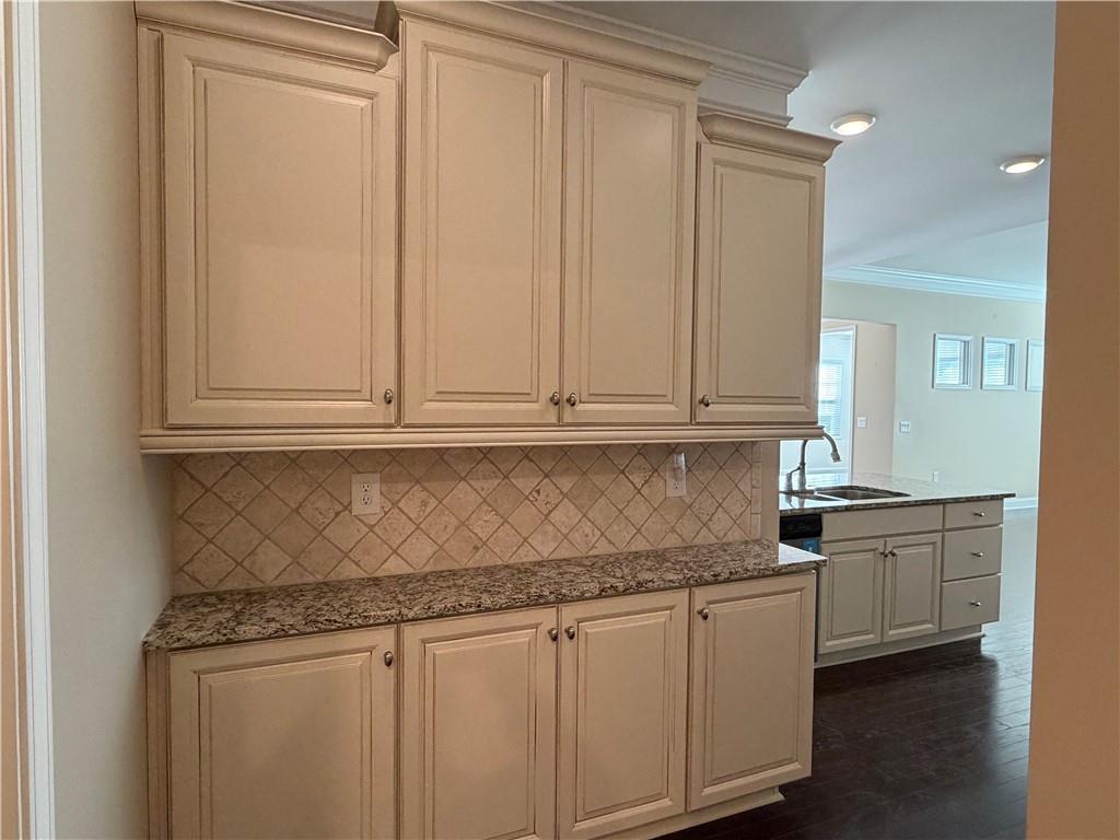 3329 Ivy Ridge Court, Unit 791 Buford, GA 30519 - Photo 14 of 36 a kitchen with granite countertop white cabinets and sink