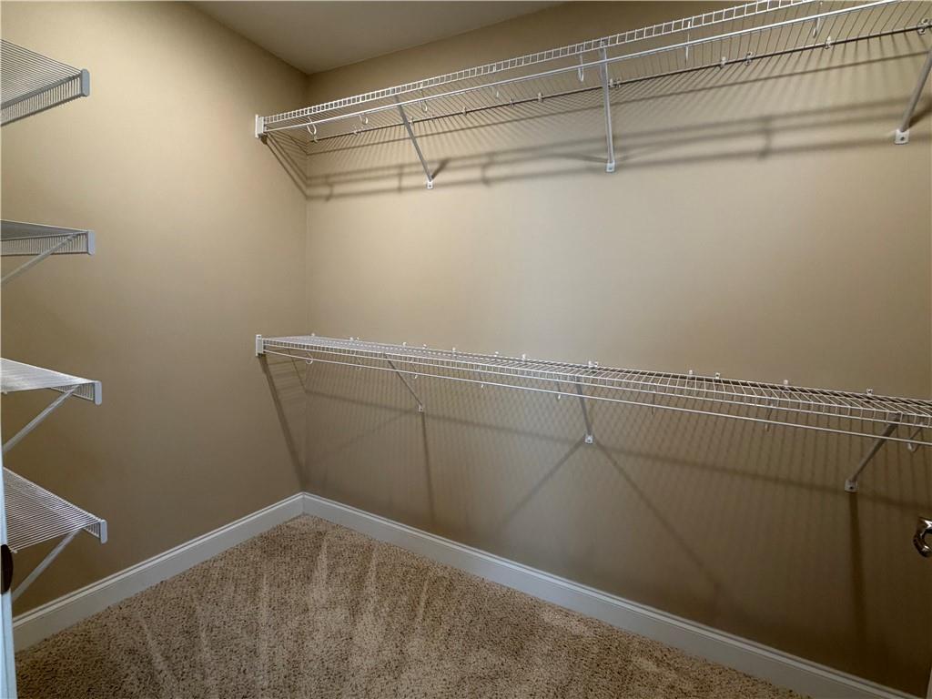 3329 Ivy Ridge Court, Unit 791 Buford, GA 30519 - Photo 20 of 36 a view of a room with racks on the wall