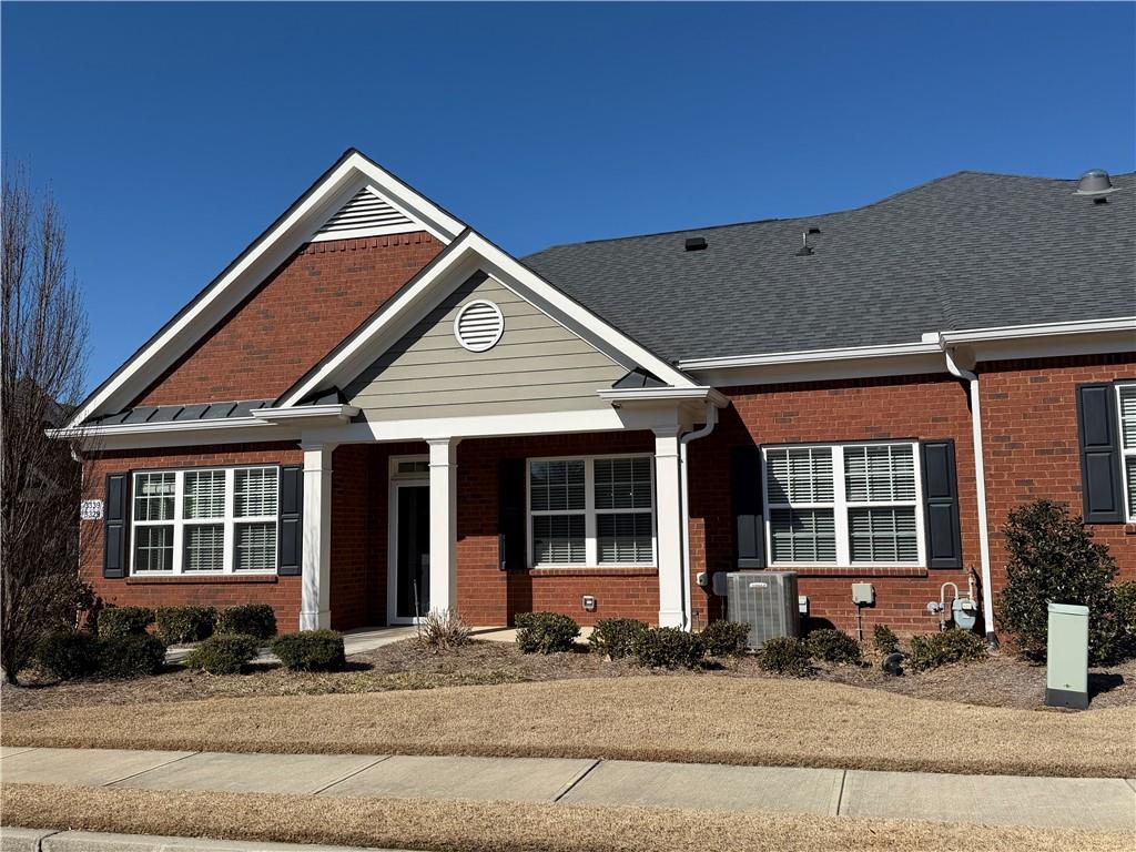 3329 Ivy Ridge Court, Unit 791 Buford, GA 30519 - Photo 2 of 36 a front view of a house with a yard