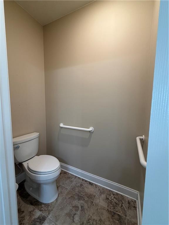 3329 Ivy Ridge Court, Unit 791 Buford, GA 30519 - Photo 21 of 36 a white toilet sitting next to a shower