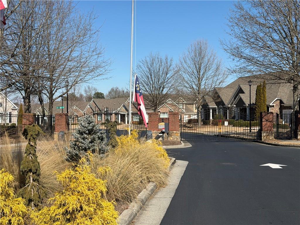3329 Ivy Ridge Court, Unit 791 Buford, GA 30519 - Photo 31 of 36 a view of a street with a building in the background