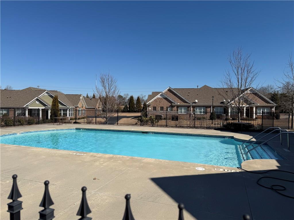3329 Ivy Ridge Court, Unit 791 Buford, GA 30519 - Photo 35 of 36 a view of house with garden space and car parked