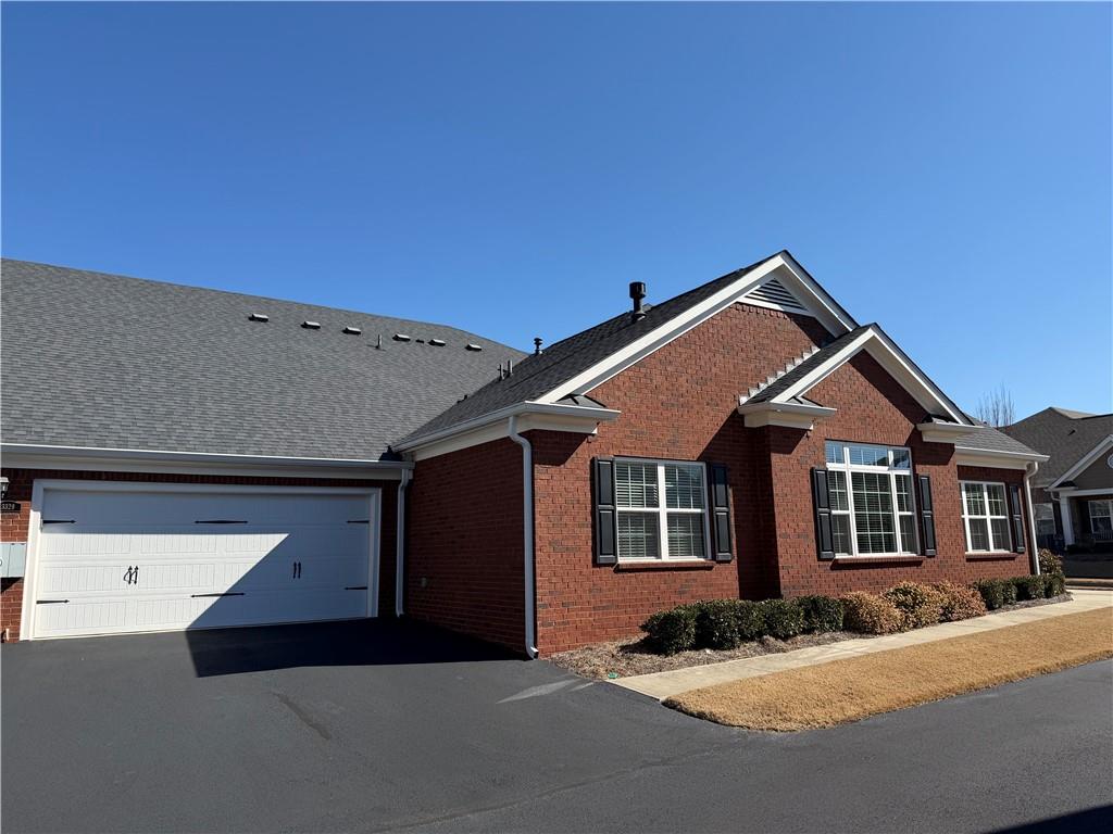 3329 Ivy Ridge Court, Unit 791 Buford, GA 30519 - Photo 4 of 36 a front view of a house with yard
