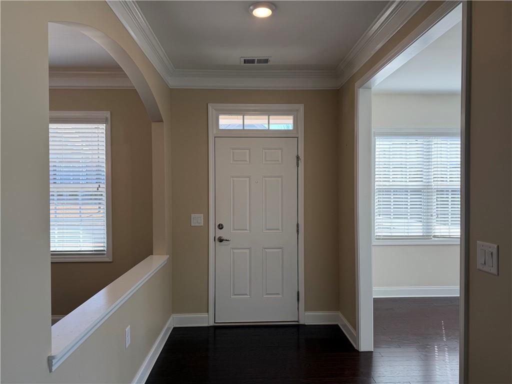 3329 Ivy Ridge Court, Unit 791 Buford, GA 30519 - Photo 5 of 36 a view of hallway with windows and wooden floor