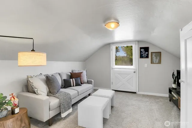 a living room with furniture and a lamp