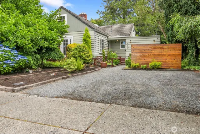 a view of a house with a yard and garage