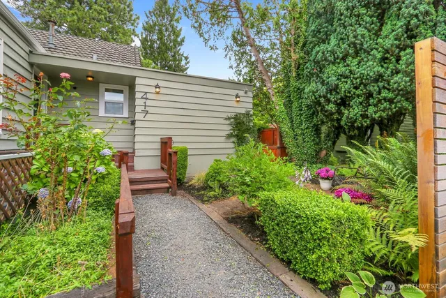 a view of a backyard with flowers