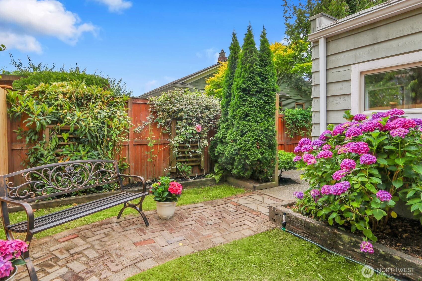 417 Ave F, Unit C Snohomish, WA 98290 - Photo 29 of 33 a small garden and flowers in front of the house