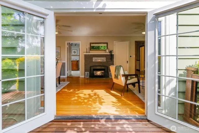 a living room with furniture a rug and a fireplace