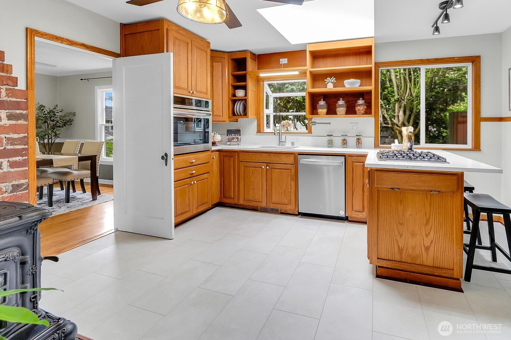 417 Ave F, Unit C Snohomish, WA 98290 - Photo 8 of 33 a kitchen with stainless steel appliances granite countertop a stove a sink and a refrigerator