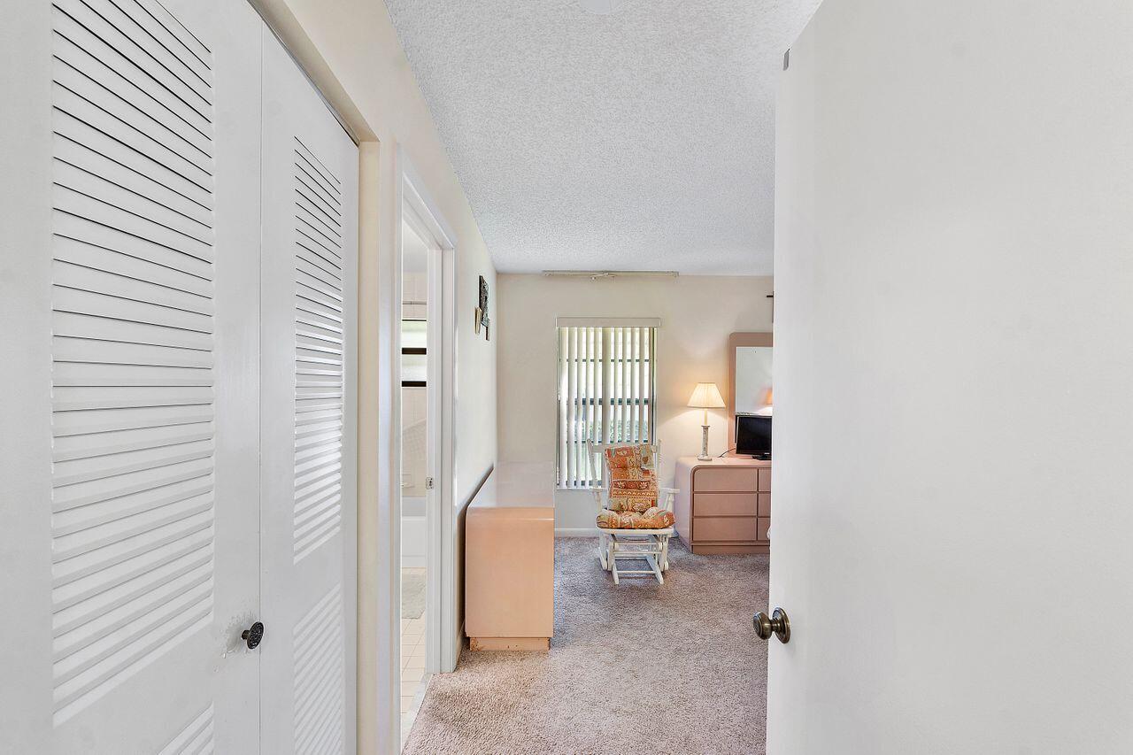 5130 Nesting Way, Unit D Delray Beach, FL 33484 - Photo 20 of 41 a living room with furniture and a window