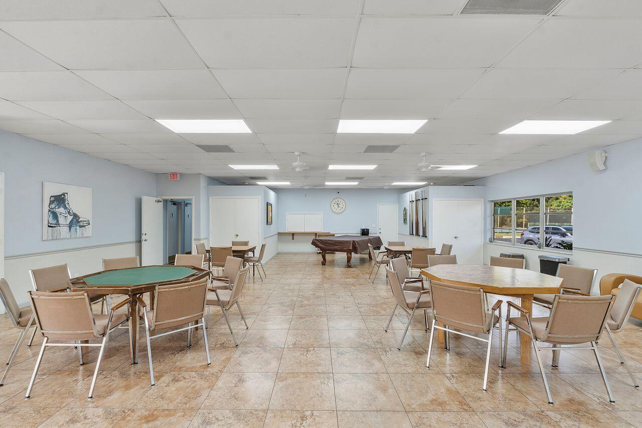 5130 Nesting Way, Unit D Delray Beach, FL 33484 - Photo 29 of 41 a view of a dining area with furniture