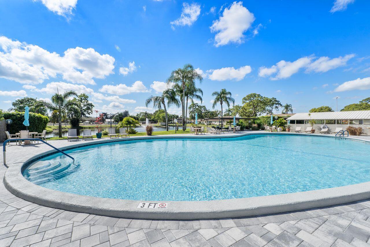5130 Nesting Way, Unit D Delray Beach, FL 33484 - Photo 31 of 41 a view of outdoor space yard and lake view