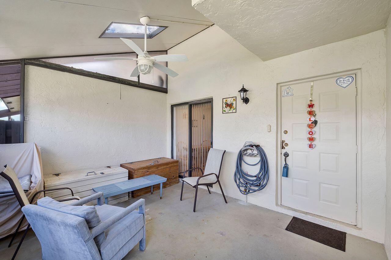 5130 Nesting Way, Unit D Delray Beach, FL 33484 - Photo 4 of 41 a view of a livingroom with furniture and a fan