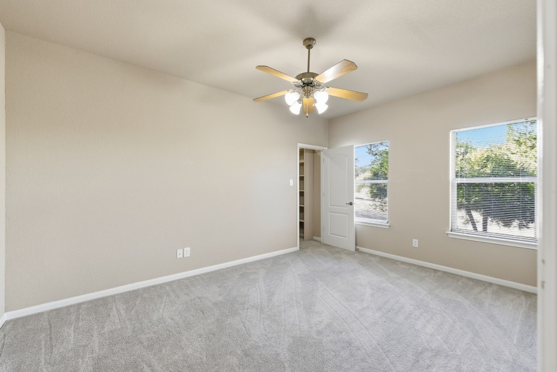 2291 Frontier Spring Branch, TX 78070 - Photo 20 of 39 an empty room with windows and fan