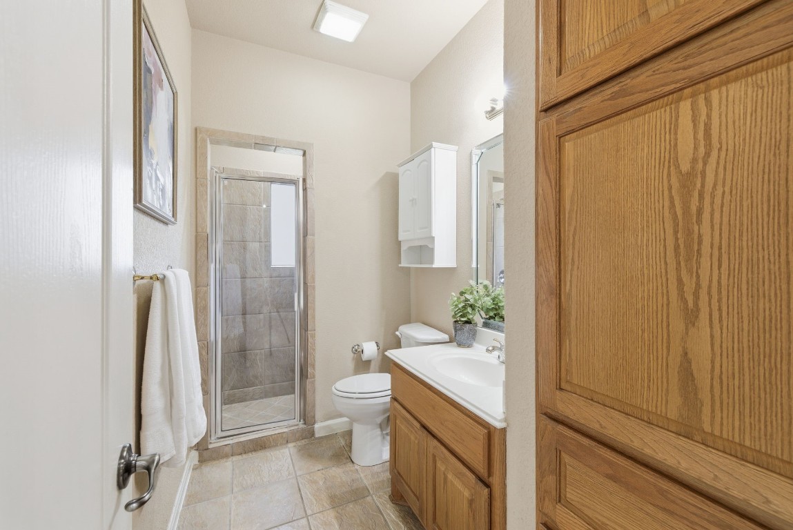 2291 Frontier Spring Branch, TX 78070 - Photo 23 of 39 a bathroom with a granite countertop sink and a mirror