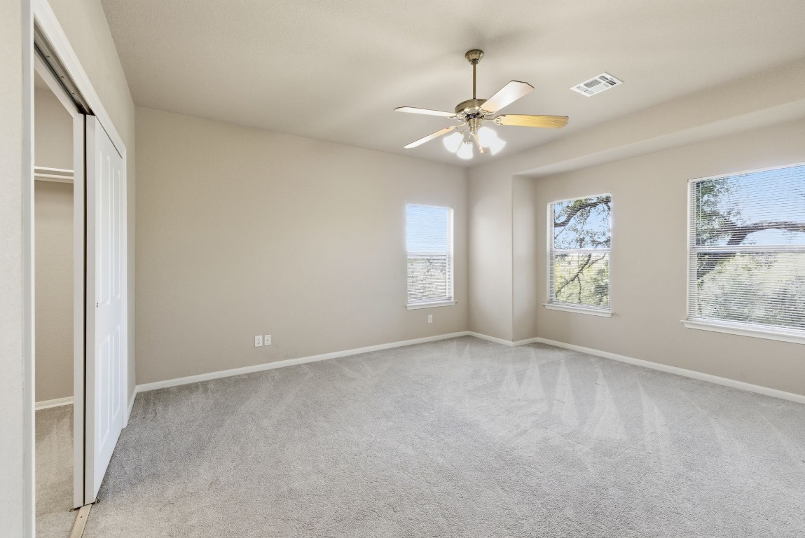 2291 Frontier Spring Branch, TX 78070 - Photo 27 of 39 an empty room with windows and fan