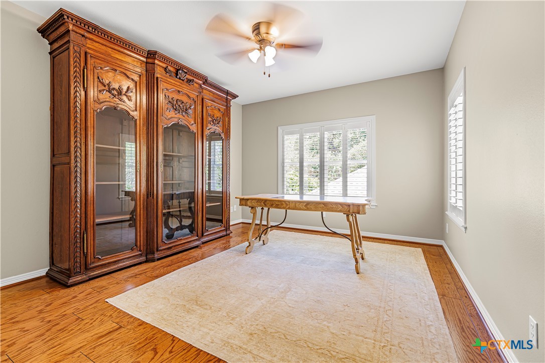 313 Treasure Oaks Road Inez, TX 77968 - Photo 27 of 47 wooden floor in an empty room with a window