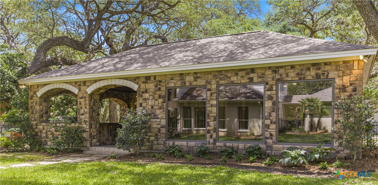 313 Treasure Oaks Road Inez, TX 77968 - Photo 28 of 47 a front view of a house with garden