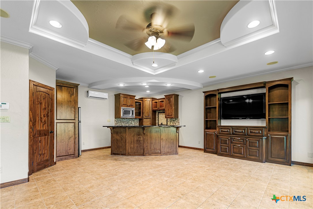 313 Treasure Oaks Road Inez, TX 77968 - Photo 30 of 47 a view of kitchen with furniture and flat screen tv