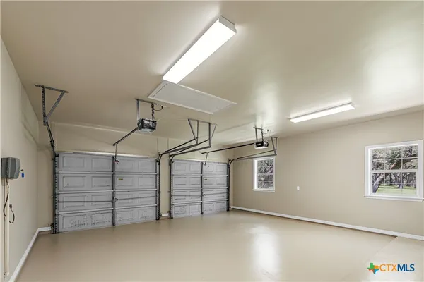 a view of water heater room with stairs