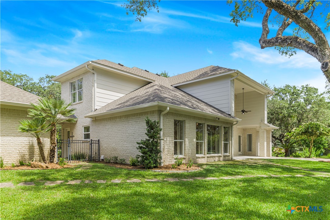 313 Treasure Oaks Road Inez, TX 77968 - Photo 33 of 47 a front view of a house with a garden