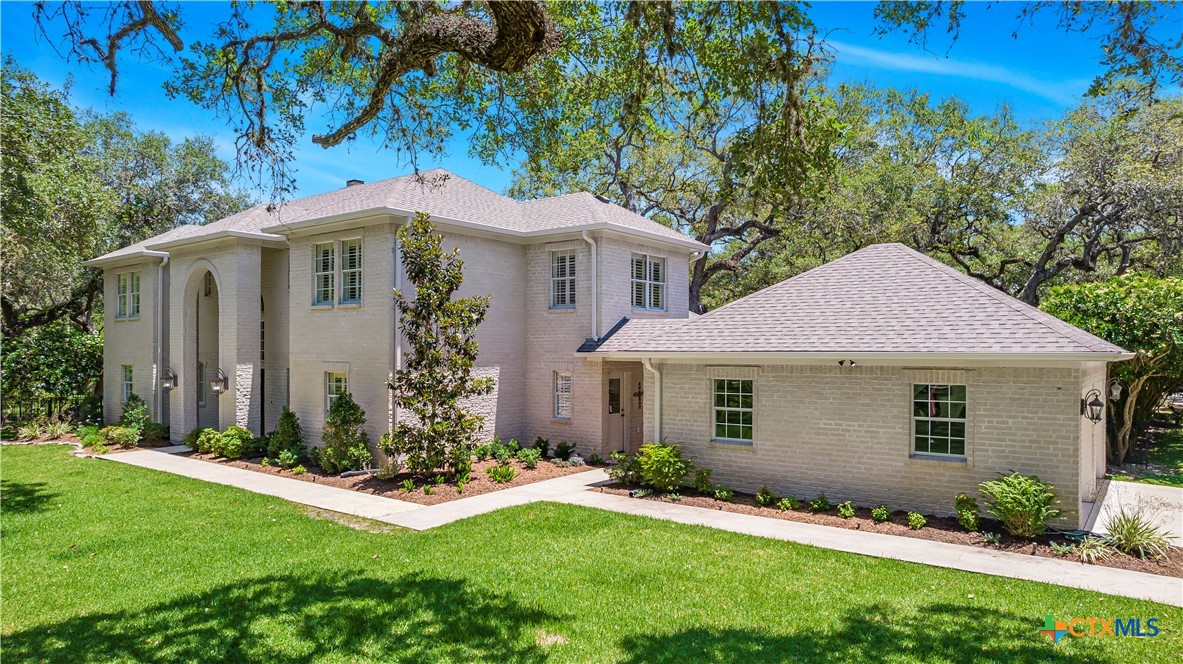 313 Treasure Oaks Road Inez, TX 77968 - Photo 5 of 47 a front view of a house with a yard
