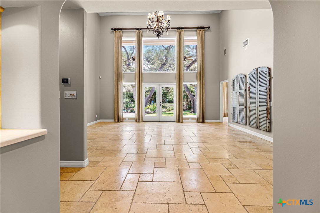 313 Treasure Oaks Road Inez, TX 77968 - Photo 7 of 47 a view of an entryway with chandelier