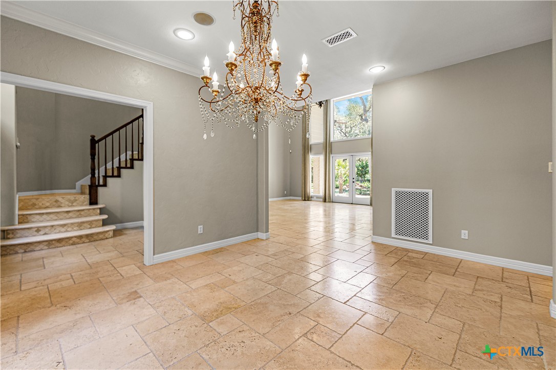 313 Treasure Oaks Road Inez, TX 77968 - Photo 8 of 47 a view of a livingroom with a chandelier