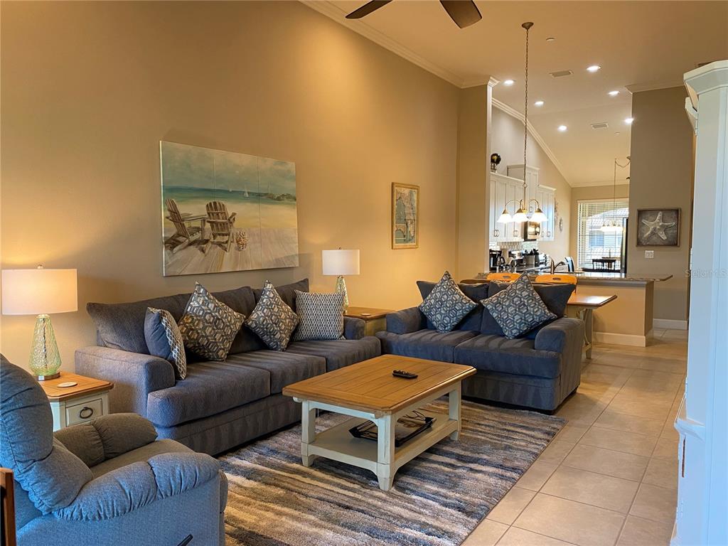 13711 Messina Loop, Unit 203 Lakewood Ranch, FL 34211 - Photo 11 of 27 a living room with furniture and a couch