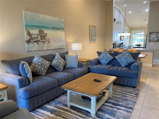 a living room with furniture and a rug