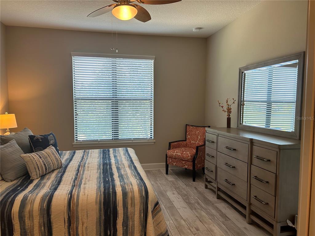 13711 Messina Loop, Unit 203 Lakewood Ranch, FL 34211 - Photo 16 of 27 a bedroom with a bed and a window