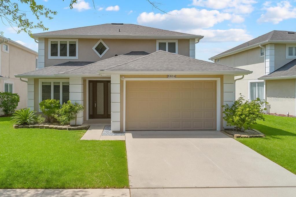 8406 Rising Star Court Kissimmee, FL 34747 - Photo 1 of 1 a front view of a house with a yard