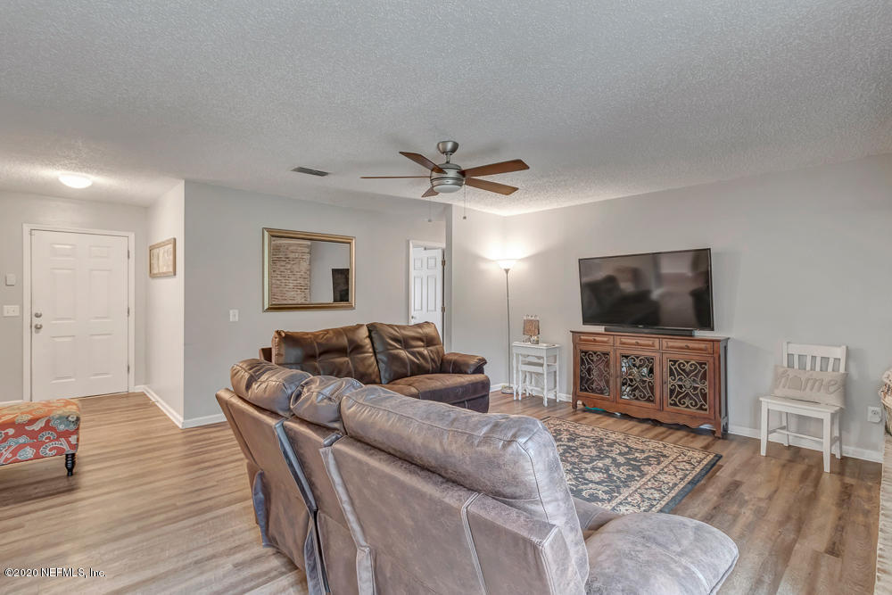 54071 Armstrong Road Callahan, FL 32011 - Photo 11 of 26 a living room with furniture and a flat screen tv
